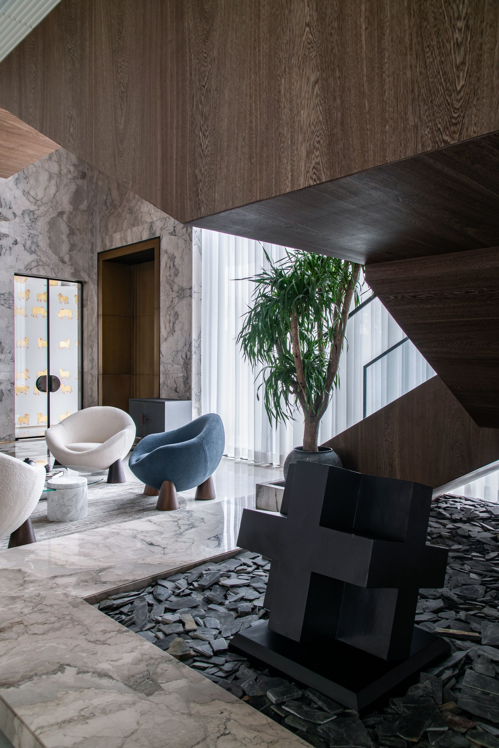 Contemporary residential interior with a sculptural staircase